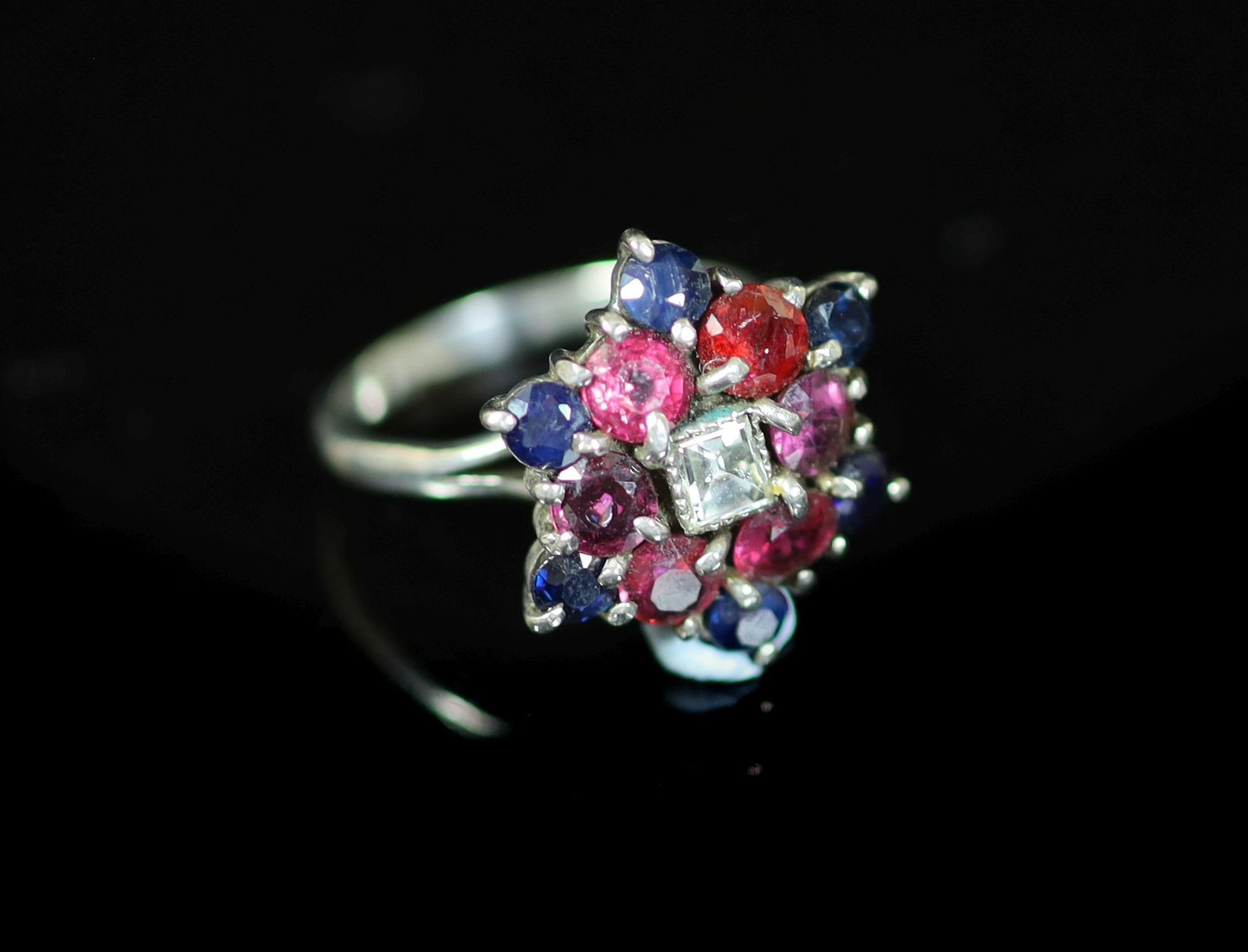 A mid 20th century platinum, ruby, sapphire diamond and amethyst cluster dress ring